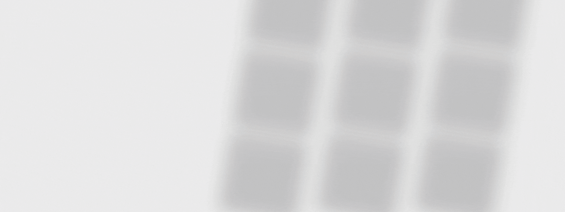 MobilityWorks Promotions Three blurry, vertical gray lines are seen against a plain white background.