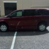 Red Dodge Grand Caravan with BraunAbility Side Entry Automatic Fold Out conversion