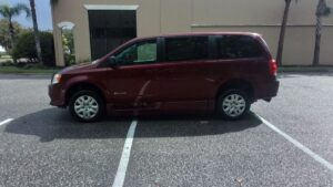 Red Dodge Grand Caravan with BraunAbility Side Entry Automatic Fold Out conversion