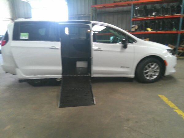 White Chrysler Voyager with Driverge Side Entry Automatic Fold Out conversion
