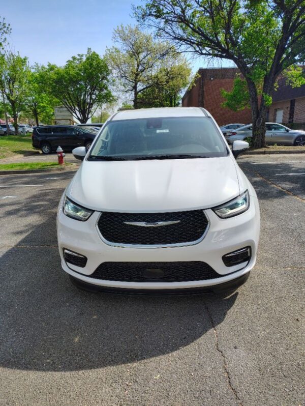 White Chrysler Pacifica with BraunAbility Side Entry Automatic Fold Out conversion