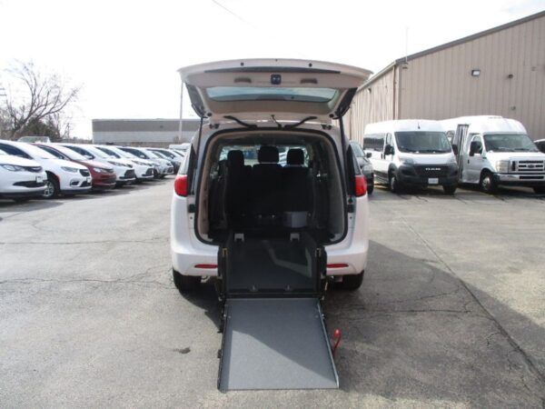 White Chrysler Voyager with Driverge Rear Entry Manual Fold Out conversion
