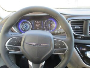 White Chrysler Pacifica with Driverge Side Entry Automatic Fold Out conversion