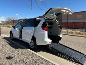 White Chrysler Voyager with BraunAbility Side Entry Automatic Fold Out conversion