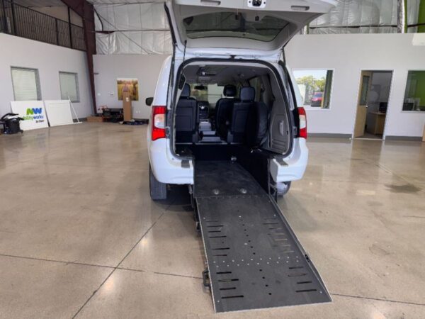 White Chrysler Town and Country with Adaptive Vans Side Entry Manual Fold Out conversion