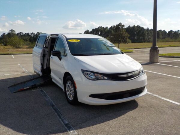 White Chrysler Voyager with Driverge Side Entry Automatic Fold Out conversion