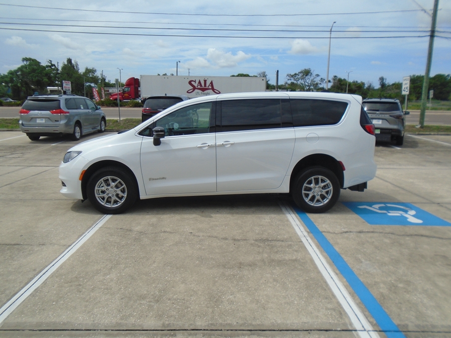 White Chrysler Voyager with BraunAbility Rear Entry Manual Fold Out conversion