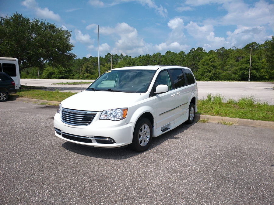 White Chrysler Town and Country with Rollx Side Entry Automatic In Floor conversion