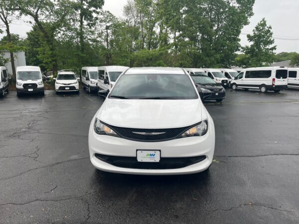 White Chrysler Voyager with BraunAbility Rear Entry Manual Fold Out conversion