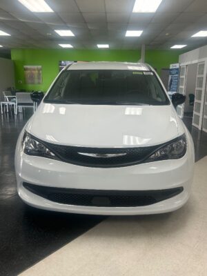 White Chrysler Voyager with Driverge Rear Entry Manual Fold Out conversion