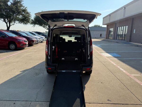 White Ford Transit Connect with Driverge Rear Entry Manual Fold Out conversion