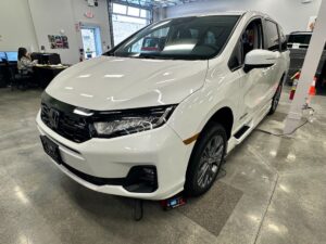 White Honda Odyssey with BraunAbility Side Entry Automatic In Floor conversion