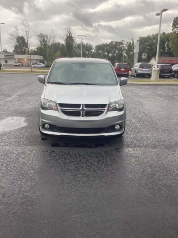 Silver Dodge Grand Caravan with Driverge Side Entry Automatic Fold Out conversion