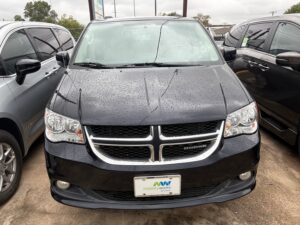 Black Dodge Grand Caravan with BraunAbility Side Entry Automatic Fold Out conversion