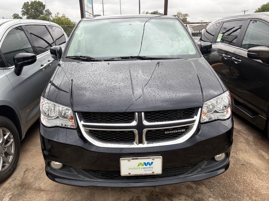 Black Dodge Grand Caravan with BraunAbility Side Entry Automatic Fold Out conversion