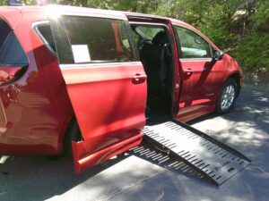 Red Chrysler Pacifica with BraunAbility Side Entry Automatic Fold Out conversion