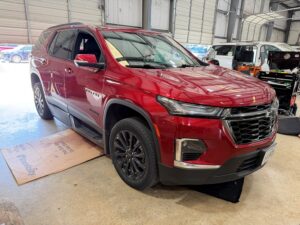 Red Chevrolet Traverse with BraunAbility Side Entry Automatic In Floor conversion