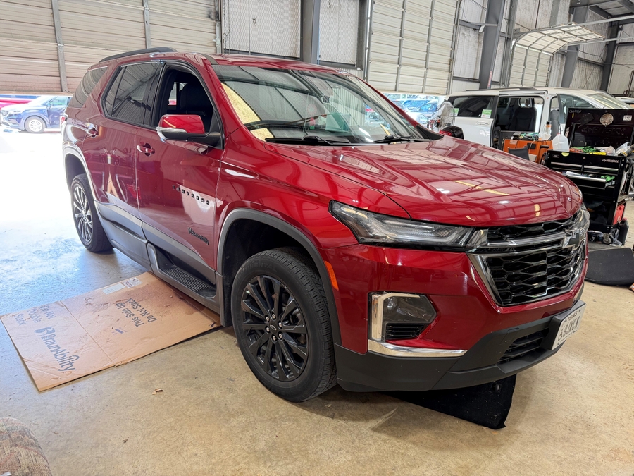 Red Chevrolet Traverse with BraunAbility Side Entry Automatic In Floor conversion
