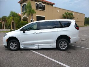 White Chrysler Pacifica with BraunAbility Side Entry Automatic Fold Out conversion