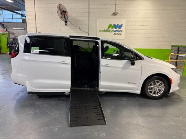 White Chrysler Voyager with Driverge Side Entry Automatic Fold Out conversion