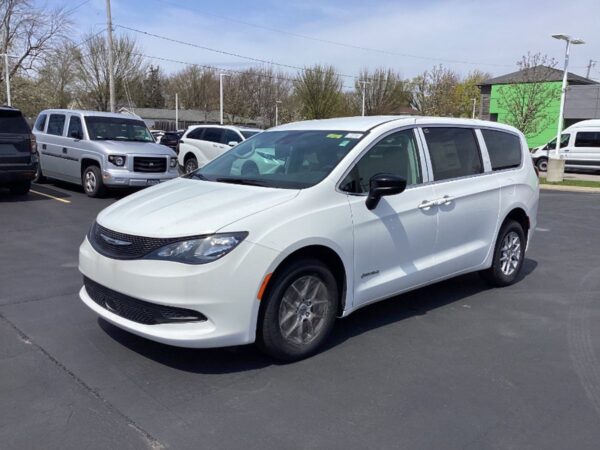 White Chrysler Voyager with Driverge Side Entry Automatic Fold Out conversion