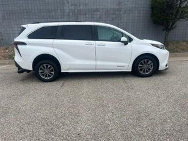 White Toyota Sienna with Driverge Rear Entry Manual Fold Out conversion