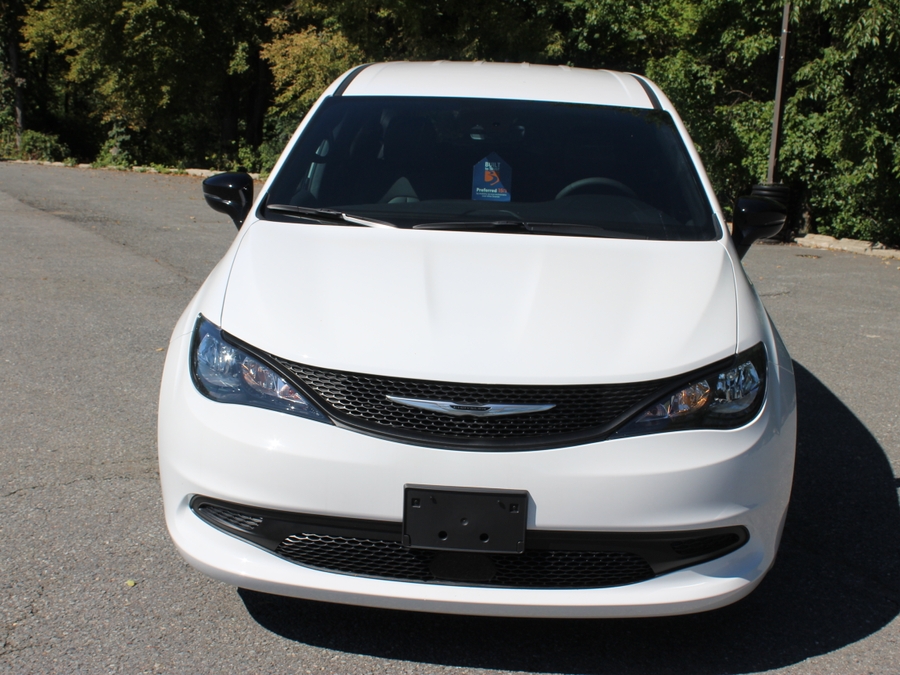 White Chrysler Voyager with BraunAbility Rear Entry Manual Fold Out conversion