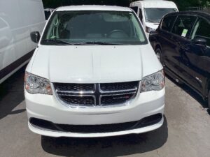 White Dodge Grand Caravan with BraunAbility Side Entry Manual Fold Out conversion