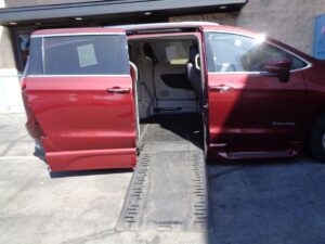 Red Chrysler Pacifica with BraunAbility Side Entry Automatic In Floor conversion