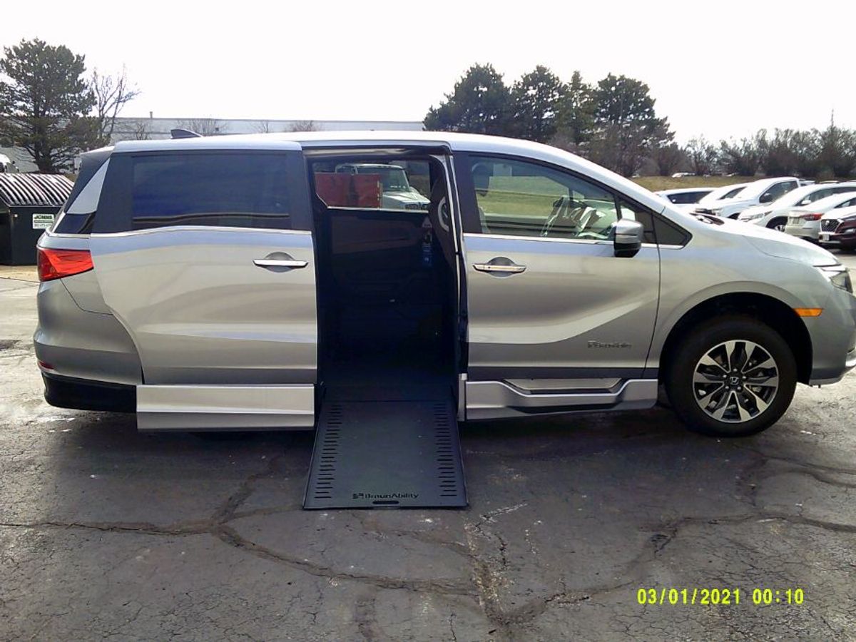 Silver Honda Odyssey with BraunAbility Side Entry Automatic In Floor conversion