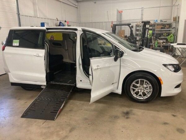 White Chrysler Voyager with Driverge Side Entry Automatic Fold Out conversion