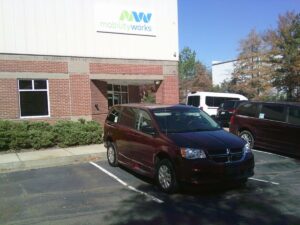Red Dodge Grand Caravan with Other Side Entry Automatic Fold Out conversion