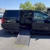 Black Dodge Grand Caravan with Driverge Side Entry Automatic Fold Out conversion