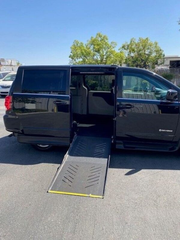 Black Dodge Grand Caravan with Driverge Side Entry Automatic Fold Out conversion