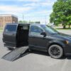Red Dodge Grand Caravan with Adaptive Vans Side Entry Automatic Fold Out conversion