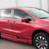 Red Honda Odyssey with BraunAbility Side Entry Automatic In Floor conversion