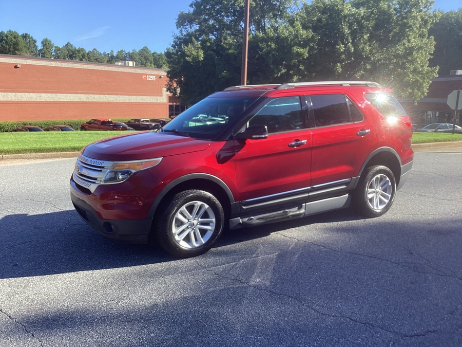 Red Ford Explorer with BraunAbility Side Entry Automatic In Floor conversion