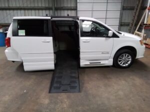 White Dodge Grand Caravan with BraunAbility Side Entry Automatic Fold Out conversion