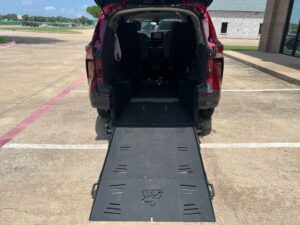 Red Toyota Sienna with Freedom Motors Rear Entry Manual Fold Out conversion
