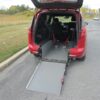 Red Chrysler Pacifica with Driverge Rear Entry Manual Fold Out conversion