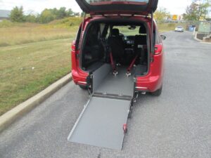 Red Chrysler Pacifica with Driverge Rear Entry Manual Fold Out conversion