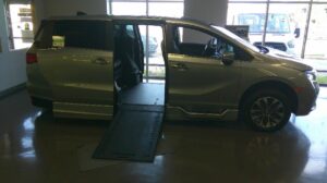 Silver Honda Odyssey with BraunAbility Side Entry Automatic In Floor conversion