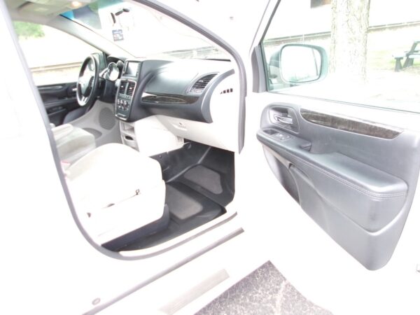 White Dodge Grand Caravan with BraunAbility Side Entry Manual Fold Out conversion