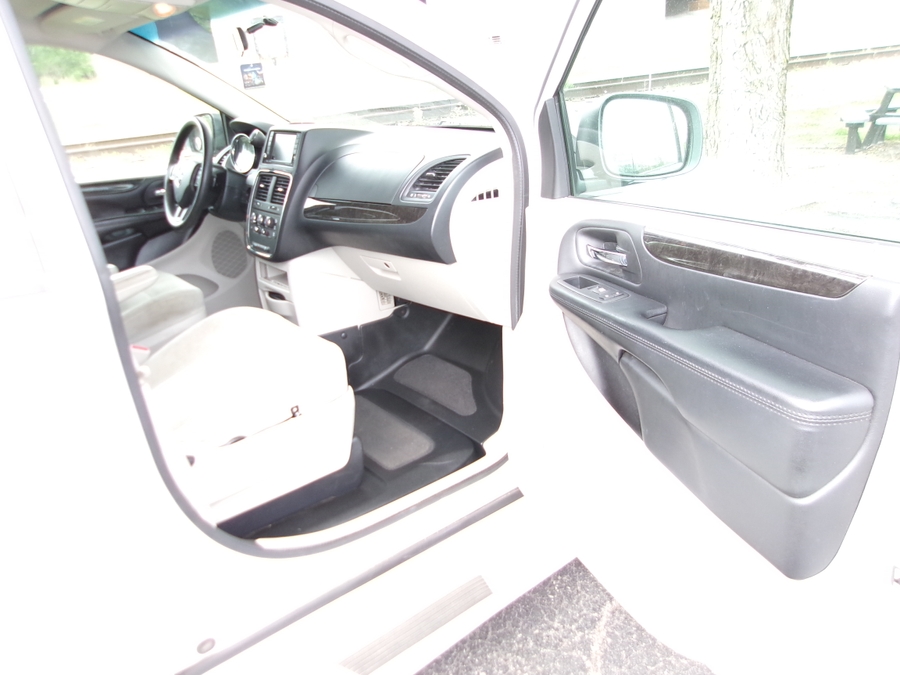 White Dodge Grand Caravan with BraunAbility Side Entry Manual Fold Out conversion