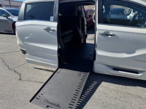White Honda Odyssey with BraunAbility Side Entry Automatic In Floor conversion