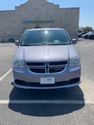 Silver Dodge Grand Caravan with BraunAbility Side Entry Automatic Fold Out conversion