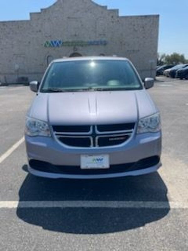 Silver Dodge Grand Caravan with BraunAbility Side Entry Automatic Fold Out conversion