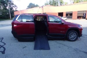 Red Chevrolet Traverse with BraunAbility Side Entry Automatic In Floor conversion
