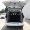 White Chrysler Pacifica with Driverge Side Entry Automatic Fold Out conversion