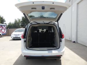 White Chrysler Pacifica with Driverge Side Entry Automatic Fold Out conversion